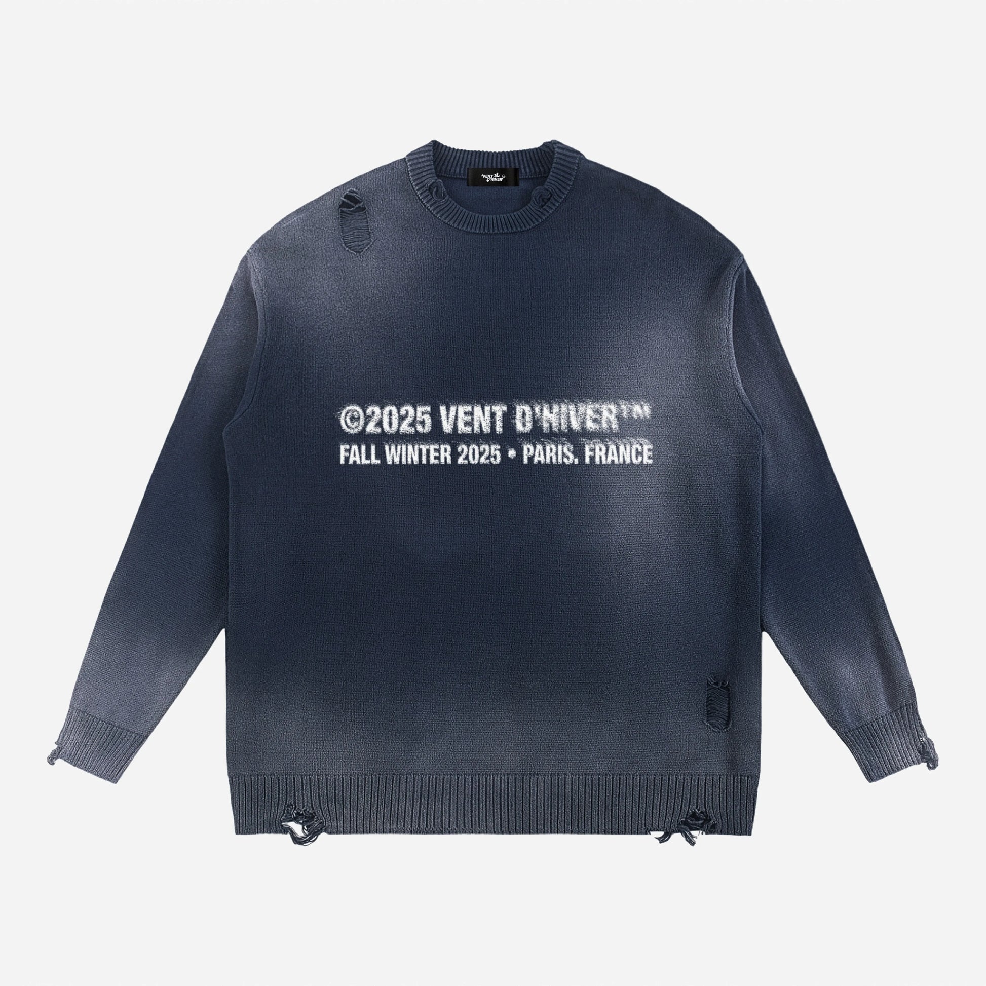 Navy sweater with white text on a light gray background